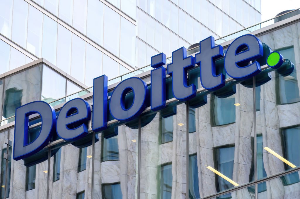 Deloitte logo or sign on a modern building facade